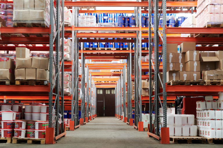 Boxes of inventory stacked in a warehouse.