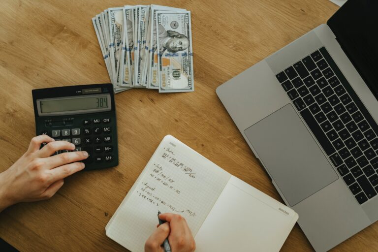 A photo of a small business owner doing their bookkeeping by hand. Little does he or she know that there are tips that can make the process a whole lot easier.